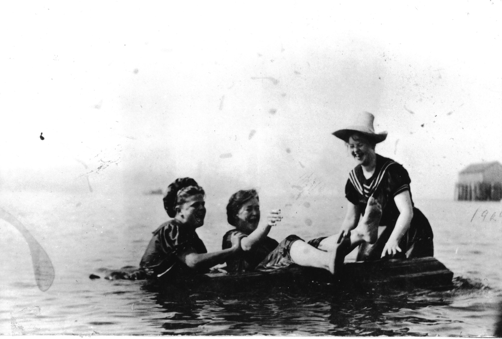 Three women swimming